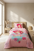 Children's bedroom with pink and floral-themed bedding set on a bed.